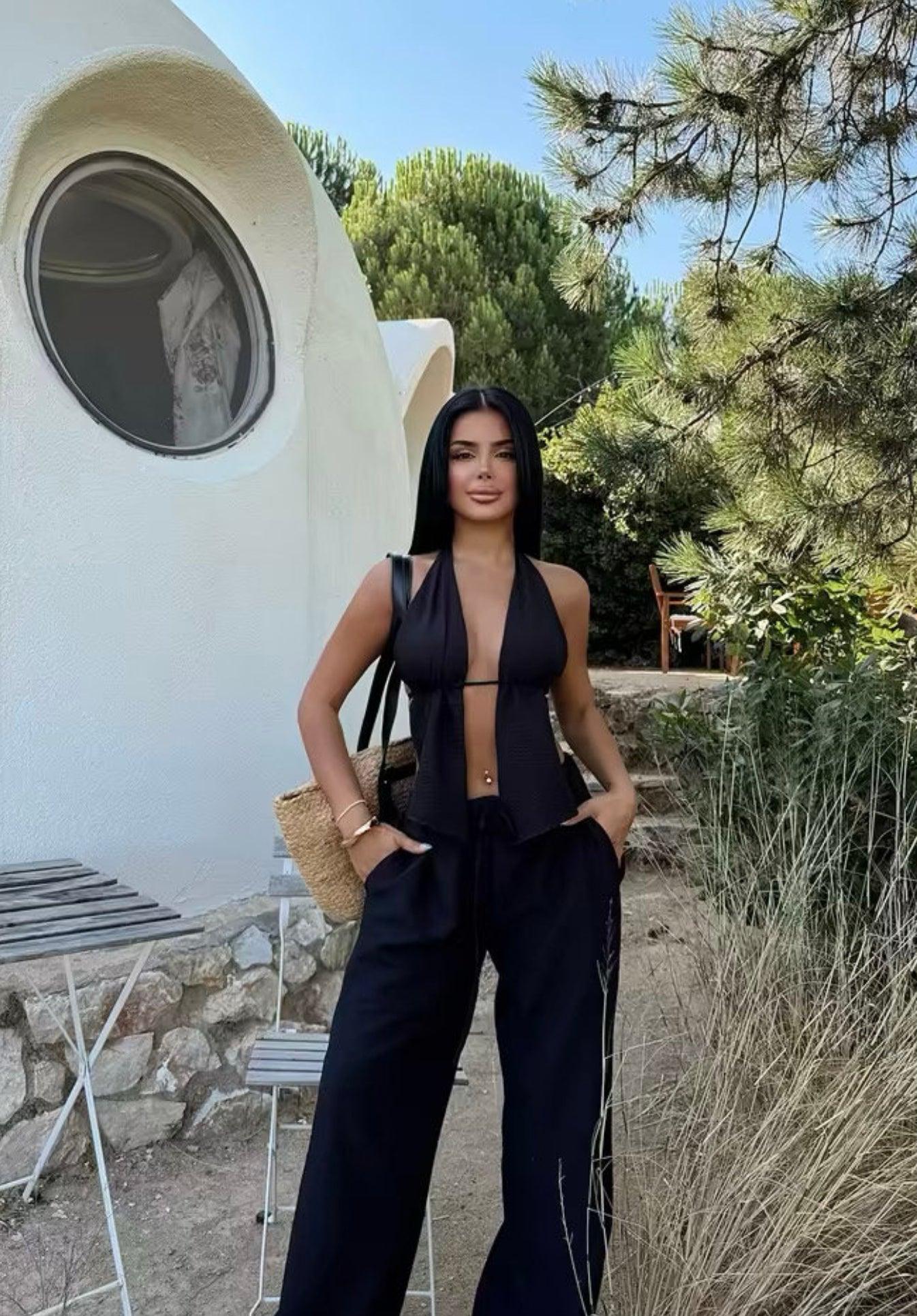 Ensemble femme noir avec haut dos nu à nouer et pantalon large fluide